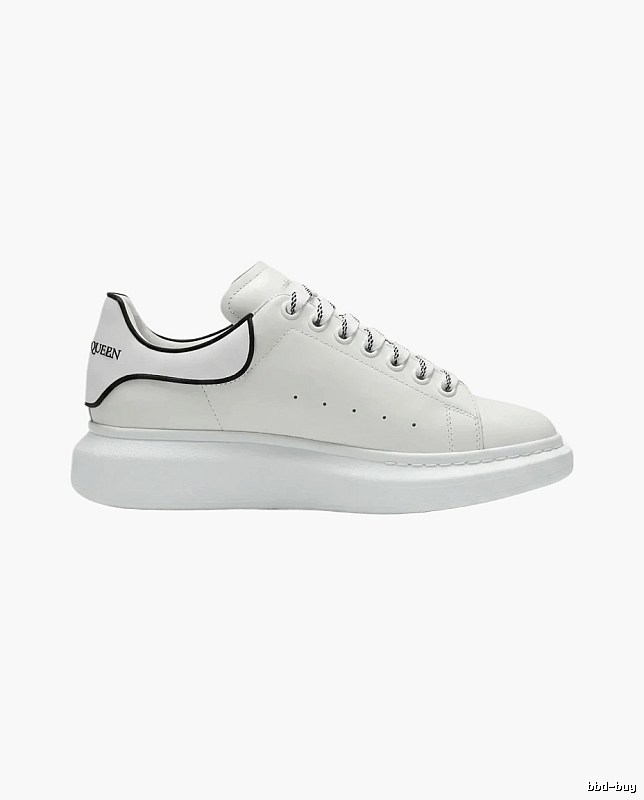 The minimalist style of McQueen white sneakers.
